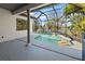 The screened lanai area features a custom pool, with an open-air view at 3635 80Th E Dr, Sarasota, FL 34243