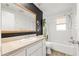 A well-lit bathroom featuring an updated vanity, tub, and shower at 3684 14Th Se Ave, Largo, FL 33771