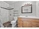 Bathroom with shower, modern vanity, neutral paint, and a large mirror at 3684 14Th Se Ave, Largo, FL 33771