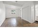 Bright bedroom featuring neutral wall paint, tile flooring, and closet at 3684 14Th Se Ave, Largo, FL 33771