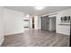 Spacious living room featuring modern flooring, a sliding barn door, and neutral paint at 3684 14Th Se Ave, Largo, FL 33771