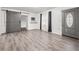 Bright living room features sleek floors, sliding barn door, and an exterior door at 3684 14Th Se Ave, Largo, FL 33771