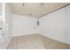 Tiled room with white block walls, providing a clean and neutral space at 3684 14Th Se Ave, Largo, FL 33771