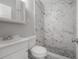 Modern bathroom featuring a marble tile shower and mosaic pebble floor at 3714 38Th N Ave, St Petersburg, FL 33713