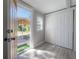 A bright bedroom features a sliding-door closet and a window to the backyard at 3714 38Th N Ave, St Petersburg, FL 33713