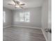 A simple bedroom that includes a ceiling fan and two large windows at 3714 38Th N Ave, St Petersburg, FL 33713