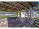 Shot of a carport adjacent to a white house with an exterior door and a small yard at 3714 38Th N Ave, St Petersburg, FL 33713