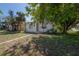 A charming home with white siding and a yard shaded by a large tree at 3714 38Th N Ave, St Petersburg, FL 33713