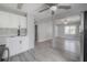 Bright kitchen featuring white cabinets, a stylish backsplash, and views of the open-concept living spaces at 3714 38Th N Ave, St Petersburg, FL 33713