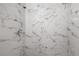 A close-up of a newly renovated shower with marble tile at 3714 38Th N Ave, St Petersburg, FL 33713