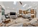 Open-concept living area with skylights seamlessly connecting to the kitchen with an island and seating at 4301 Carson Ne St, St Petersburg, FL 33703