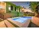 Exterior view of the home's pool and spa illuminated at twilight, highlighting the stylish design and outdoor appeal at 4301 Carson Ne St, St Petersburg, FL 33703