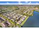 Aerial shot showcases a charming community nestled near a lake and surrounded by nature at 435 Kensington Lake Crk, Brandon, FL 33511