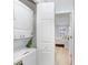 Laundry room with stacked washer and dryer, with a view into the bedroom at 435 Kensington Lake Crk, Brandon, FL 33511