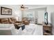 Comfortable living room featuring a plush sofa, stylish decor, and tiled floors, creating a welcoming space at 435 Kensington Lake Crk, Brandon, FL 33511