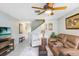 Inviting living room with a ceiling fan, comfortable seating, and a tiled floor, perfect for relaxing and entertaining at 435 Kensington Lake Crk, Brandon, FL 33511