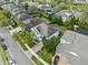 Aerial view of the rear of a two-story house, landscaping, and neighborhood streets at 5305 Sagecrest Dr, Lithia, FL 33547