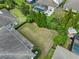 Aerial view of spacious backyard features mature trees, landscaping, pool and patio at 5305 Sagecrest Dr, Lithia, FL 33547