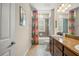 Bathroom featuring double sinks, modern fixtures, colorful shower curtain, and tile flooring at 5305 Sagecrest Dr, Lithia, FL 33547