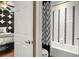 Bathroom boasts a modern black and white color scheme with a shower and bathtub at 5305 Sagecrest Dr, Lithia, FL 33547