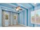 Blue and white striped bedroom with decorative patterned curtains and abundant natural light at 5305 Sagecrest Dr, Lithia, FL 33547