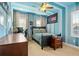 Decorated bedroom with a bed, striped walls, ceiling fan, and unique decor creating a fun atmosphere at 5305 Sagecrest Dr, Lithia, FL 33547