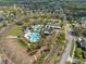 Aerial view of community center with swimming pool, playground, clubhouse, and parking at 5305 Sagecrest Dr, Lithia, FL 33547