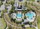 Aerial view of large community pool with lounge chairs and recreational water features at 5305 Sagecrest Dr, Lithia, FL 33547