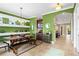 Dining area with large wooden table, shelving, and view into open floorplan at 5305 Sagecrest Dr, Lithia, FL 33547