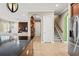 View of the entryway from the kitchen, leading to staircase and living room at 5305 Sagecrest Dr, Lithia, FL 33547