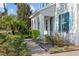 Beautiful home exterior showcasing a brick walkway with lush, well-maintained landscaping at 5305 Sagecrest Dr, Lithia, FL 33547