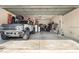 Spacious two-car garage featuring ample storage space and a parked car at 5305 Sagecrest Dr, Lithia, FL 33547