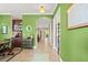 Inviting hallway featuring tile flooring and views into other living spaces at 5305 Sagecrest Dr, Lithia, FL 33547