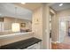 Hallway featuring overhead pendant lighting and a view to the main bedroom at 5305 Sagecrest Dr, Lithia, FL 33547