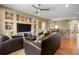 Bright living room includes hardwood flooring, built-in shelving and comfortable seating at 5305 Sagecrest Dr, Lithia, FL 33547