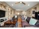 Open-concept living room with hardwood floors, ceiling fan, and view of the home's second story at 5305 Sagecrest Dr, Lithia, FL 33547