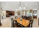 Spacious living area featuring stylish décor, a cozy seating arrangement, and seamless flow to the kitchen at 5305 Sagecrest Dr, Lithia, FL 33547