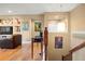 Upstairs loft featuring wood floors, stylish decor and a view to the floor below at 5305 Sagecrest Dr, Lithia, FL 33547