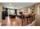 Upstairs loft featuring a seating area with leather chairs, wood floors, and large windows at 5305 Sagecrest Dr, Lithia, FL 33547