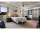 Spacious main bedroom with tray ceilings, carpet floors, and large windows at 5305 Sagecrest Dr, Lithia, FL 33547