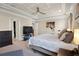 This primary bedroom features an elegant tray ceiling, and neutral colors providing a serene retreat at 5305 Sagecrest Dr, Lithia, FL 33547