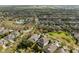 Aerial view of neighborhood with sidewalks, mature trees, and residential homes at 5305 Sagecrest Dr, Lithia, FL 33547