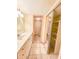 Bathroom features a white vanity, closet and tile flooring at 6020 Shore S Blvd # 1009, Gulfport, FL 33707