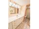 Bathroom features a white vanity with storage and a toilet adjacent to the sink at 6020 Shore S Blvd # 1009, Gulfport, FL 33707