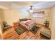 Cozy bedroom featuring a comfortable bed, ceiling fan, and wood-look flooring at 6020 Shore S Blvd # 1009, Gulfport, FL 33707