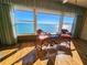 Bright living room with large windows showcasing stunning water views and wood floors at 6020 Shore S Blvd # 1009, Gulfport, FL 33707
