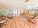 Spacious living room with multiple seating areas, mirrors, and an open floor plan at 6020 Shore S Blvd # 1009, Gulfport, FL 33707