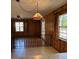 Bright living room with wood paneling, a breakfast bar and adjacent kitchen at 604 Druid Hills Rd, Temple Terrace, FL 33617