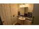 Cozy bathroom featuring a pedestal sink and vanity with mosaic tile accents at 7 Drury Ln, Tarpon Springs, FL 34689