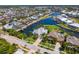 An aerial view showcases the home's prime waterfront location in a neighborhood with canals and beautiful houses at 708 Islebay Dr, Apollo Beach, FL 33572